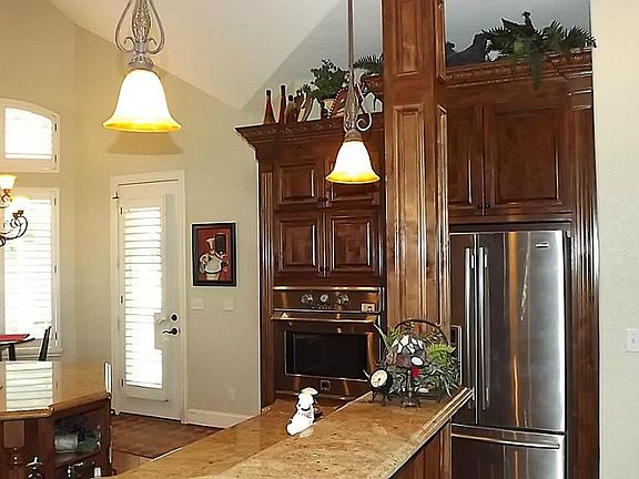 Kitchen opens to great room and formal dining.