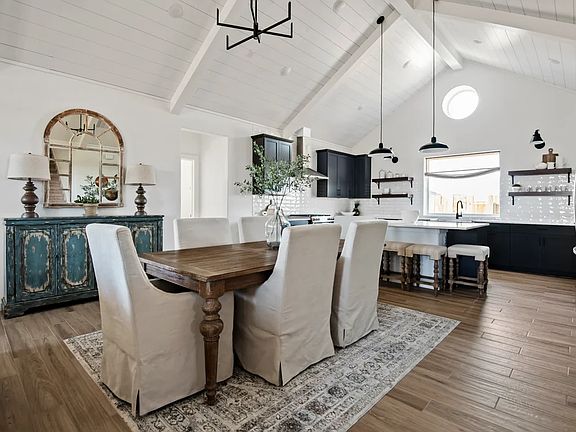 Dining area great room with vaulted ceiling and optional white-painted ceiling beams