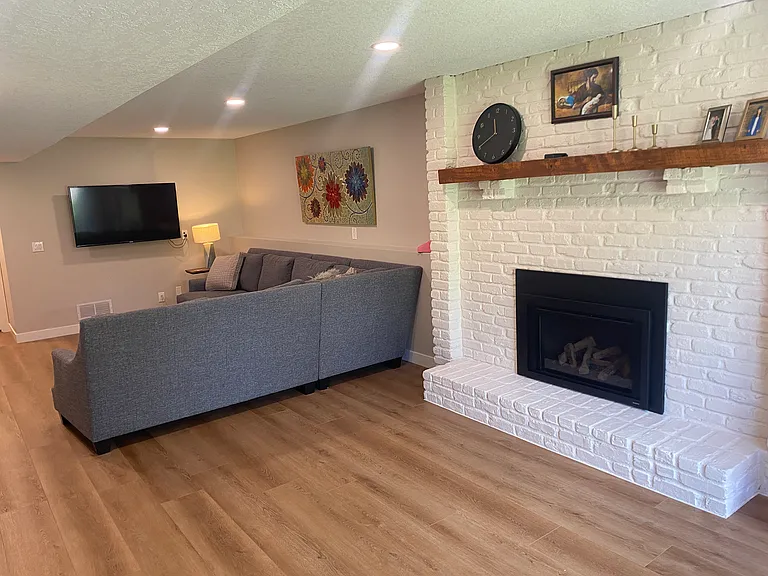 Family room on 3rd level with remote-start gas fireplace