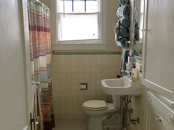 Bathroom has a large cabinet with tons of storage