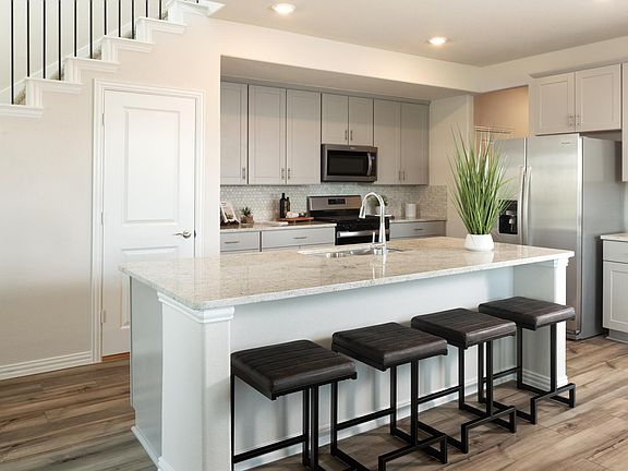 Cook dinner while your company sits around the kitchen island