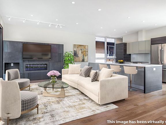 Main floor living and kitchen. Opens to courtyard for indoor/outdoor living.