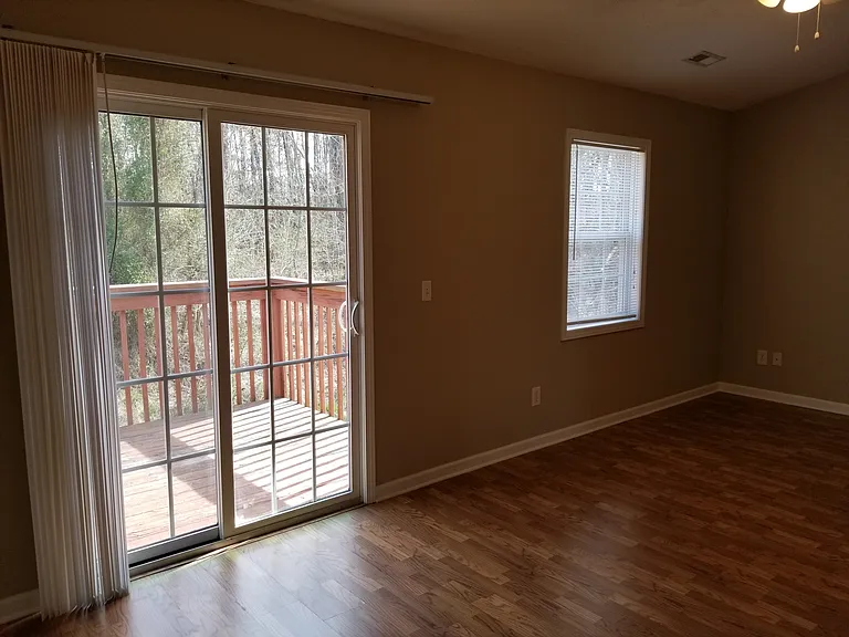 MASTER BEDROOM DOORS LEADING OUT TO BALCONY