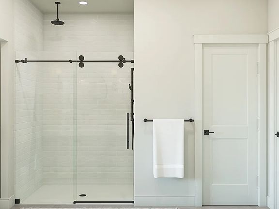 Primary bath with glass shower enclosure