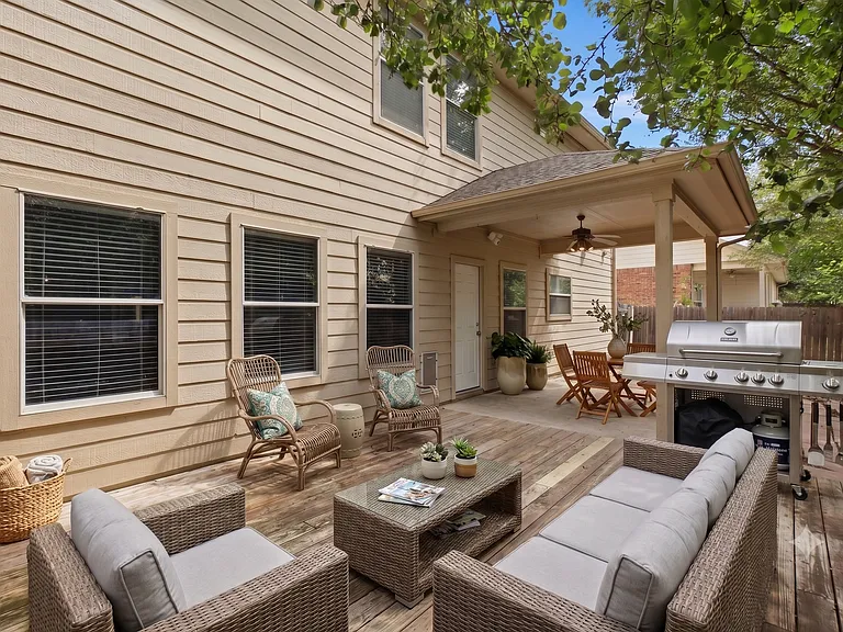 Large wooden deck and covered patio - staged