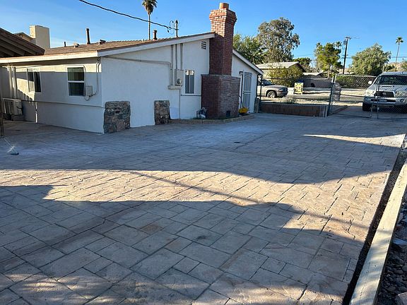 Patio area to front door and garage in back (all fenced in)