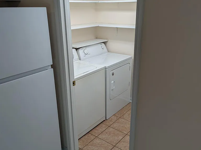 1st floor - washer & dryer unit in laundry room.