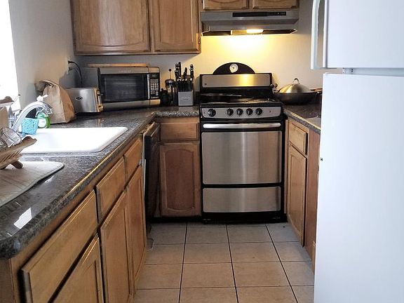 Galley kitchen with disposal and dishwasher.