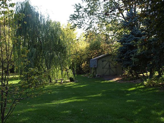 large shed and backyard.  Shed is wired.