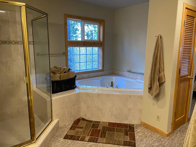 Mater bath off of first floor master bedroom Large walk-in shower as well as a jacuzzi tub