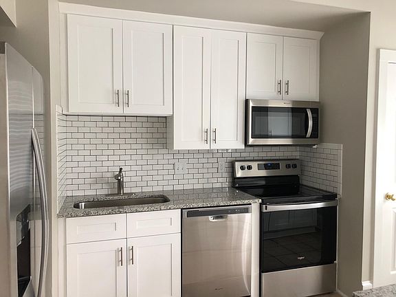 New cabinets in kitchen on both sides of galley. All new stainless appliances. Beautiful new granite, oversize sink, and updated hardware.