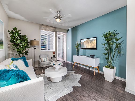 Wood-look plank flooring runs through the living spaces of a