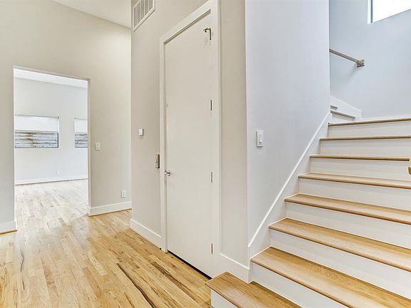 The door to the left of the stairs opens to the elevator that goes to every floor.