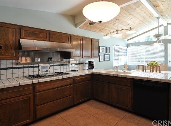 Large Kitchen with Eating area looking out at the pool.