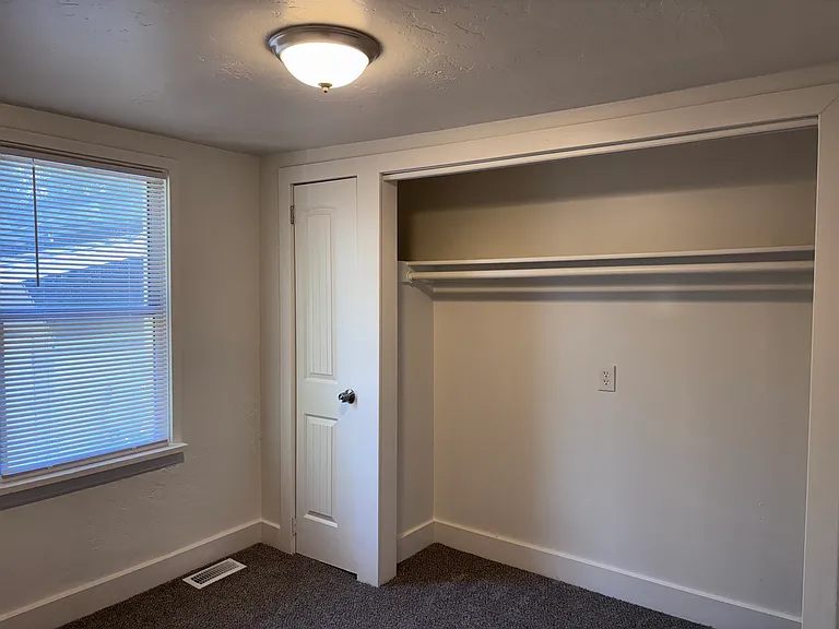 Bedroom 2 with double closets plus storage