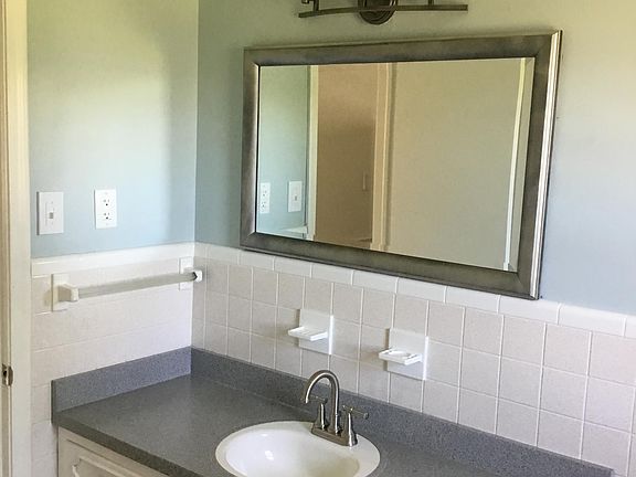 Hallway bath with plenty of storage, linen closet and new fixtures
