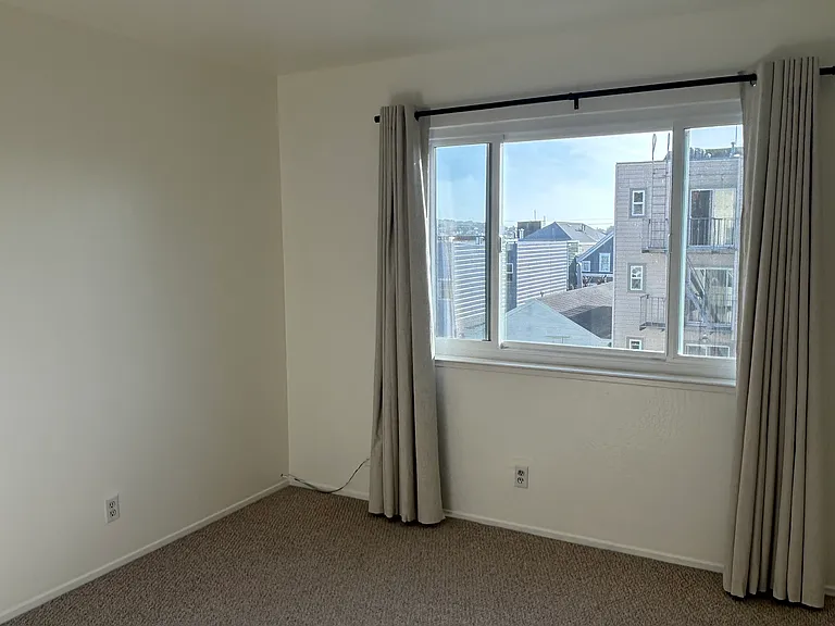 Bedroom #2 faces west and is situated at rear of the apartment building.