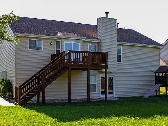 Beautiful spacious backyard.  Newly stained 10 X 10 deck! Concrete walkway from the front of the house!     Bring on family BBQ! Playground set does not stay.