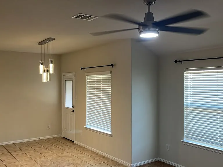 Living room, dining room and back door to back porch
