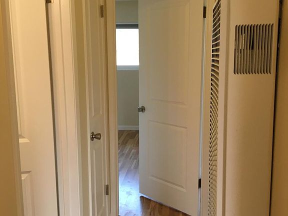 Hallway with two storage closets