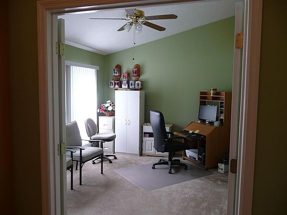 Living Rm or Home Ofc to left of foyer has doors.