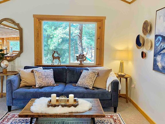 Living room offers large couch and comfortable accent chair