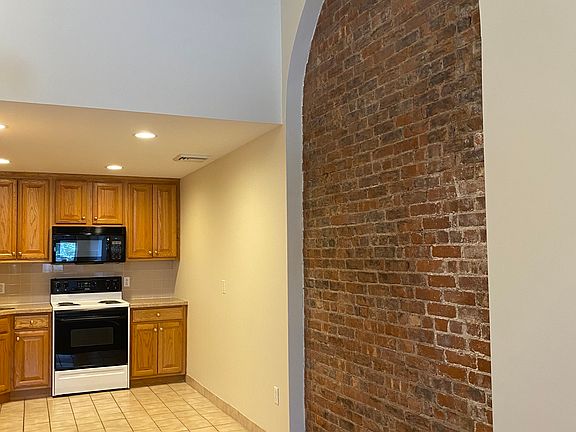 Dining Area outside of Kitchen, exposed brick wall