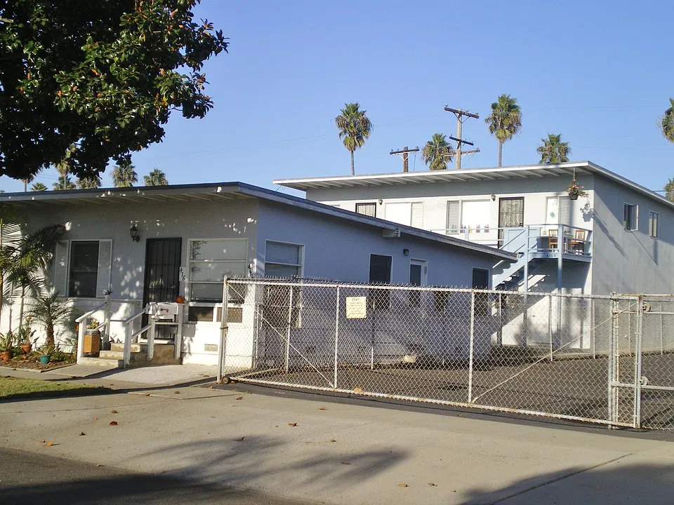 Newly painted exterior. Courtyard between buildings for get togethers!