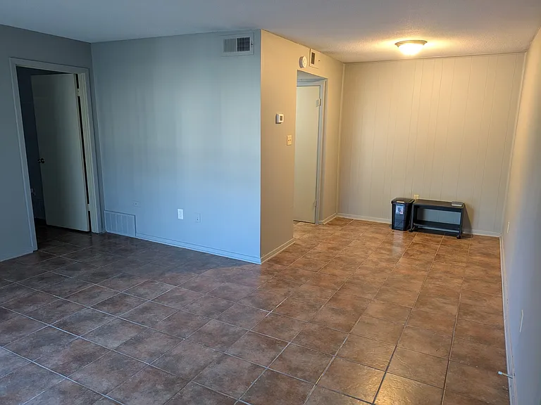This is a view of the dining area. The microwave you see here has been installed in the kitchen.