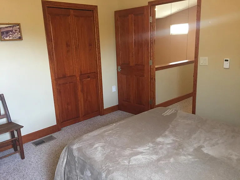 Upstairs bedroom looking toward hallway.