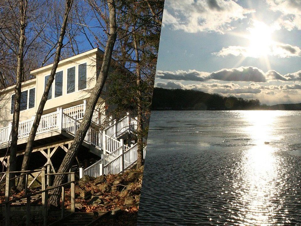 Modern lake front in a wooded setting offers privacy and great views.