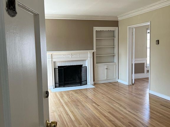 Door to unit and spacious living room