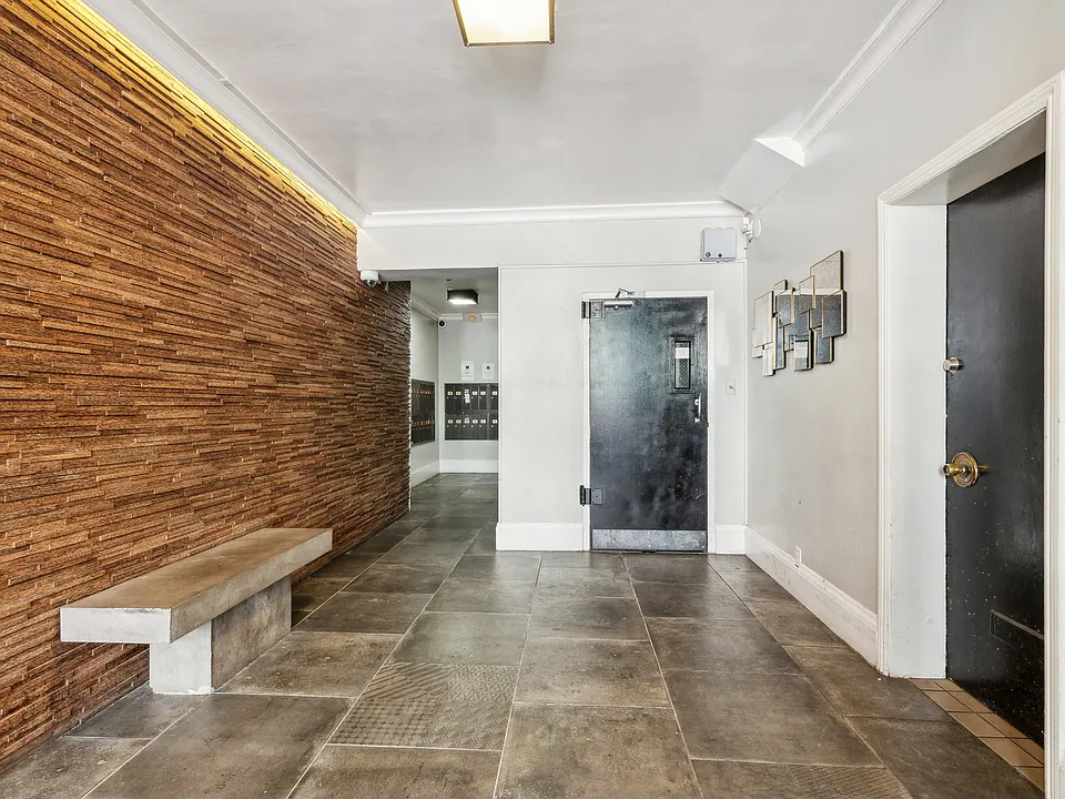 Hallway with a wooden wall and a bench