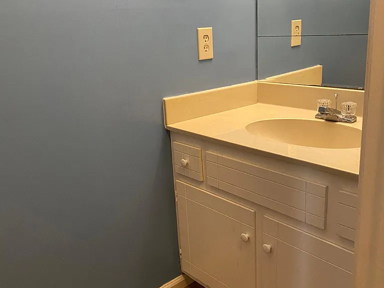 1/2 Bath in Downstairs Hallway by Living Room