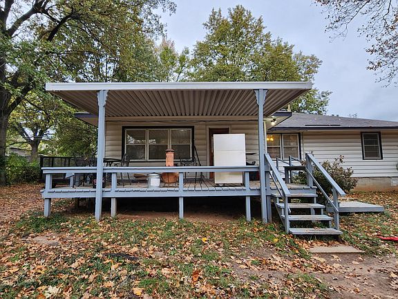 Large covered back deck overlooking an enormous fenced backyard