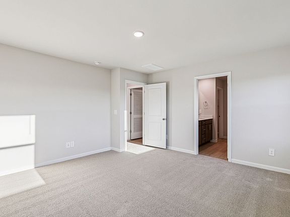 Primary bedroom in the Lennon floorplan at a Meritage Homes community in Garner, NC.