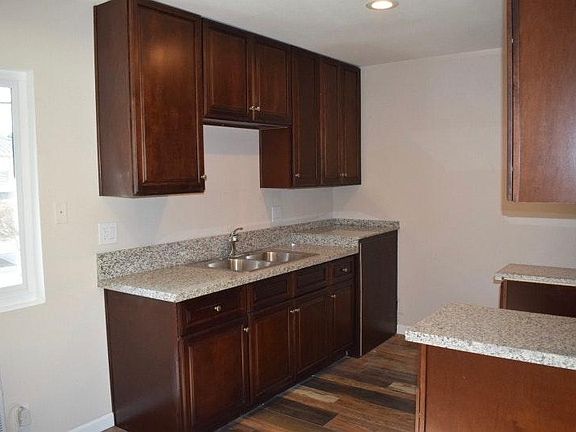 Dark Maple Cabninets and Granite Countertops