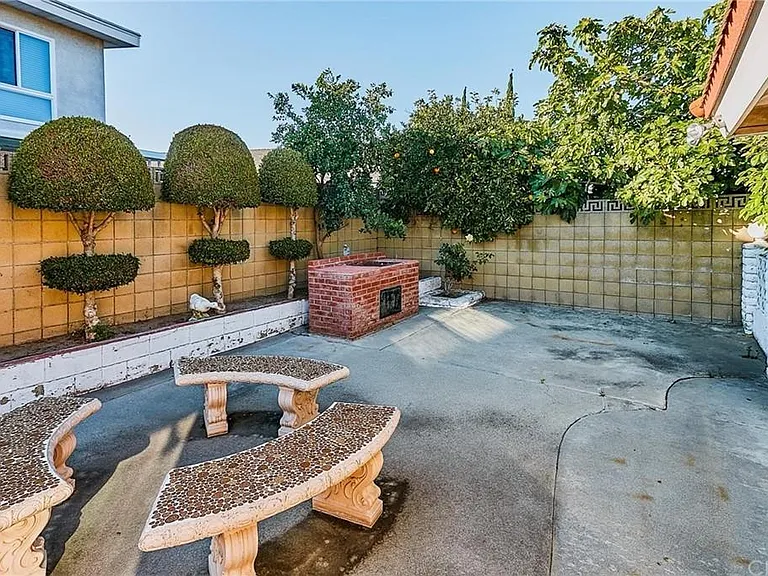 BBQ and seating in backyard