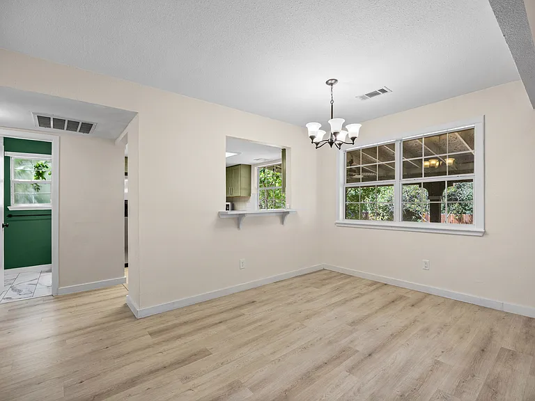 Dining area with easy access to the kitchen and downstairs bathroom.