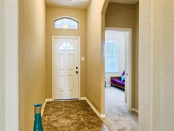 BRIGHT FOYER WITH CERAMIC TILE FLOORING