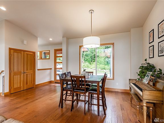 Large windows throughout the home bring in light and views of the surrounding landscape.