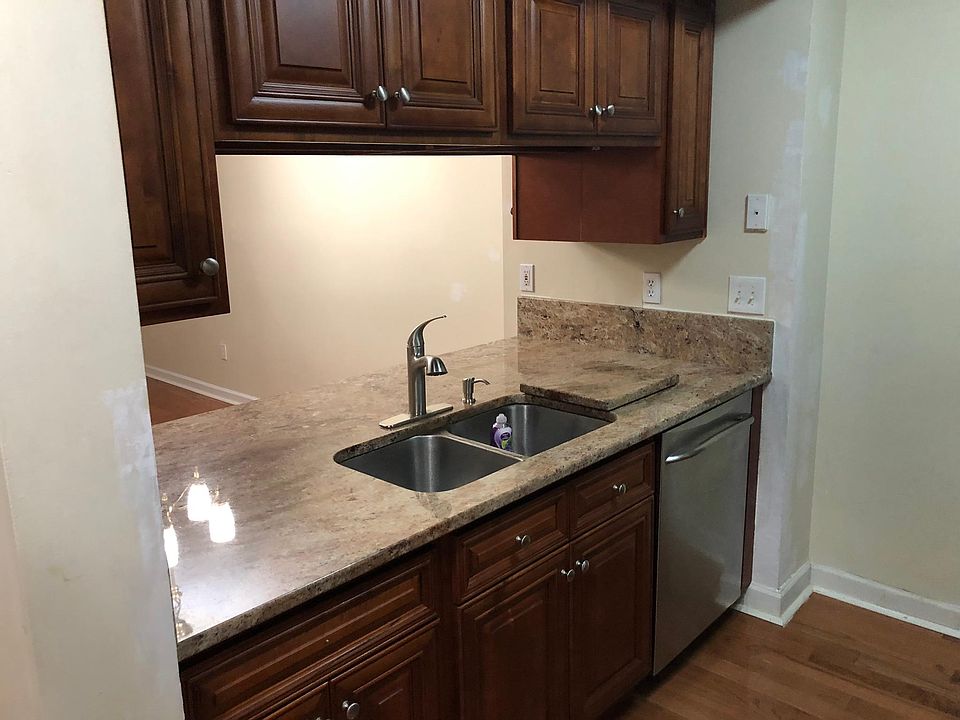 Kitchen with beautiful granite counter top with fauct