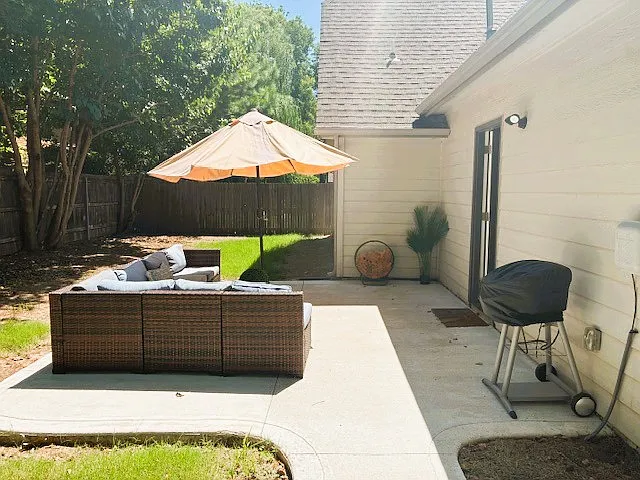 Back patio w/ seating (cushions in garage). Electric grill, outdoor game