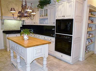 Kitchen. Custom Kitchen with Dining area, Center Island, sleek black granite & black subway tile.