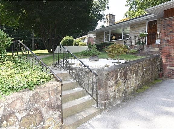 Steps up to entrance of custom built home.