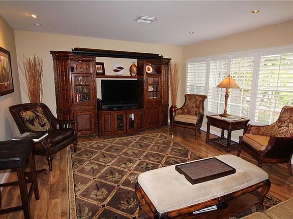 Gorgeous wood look floors and Plantation Shutters.