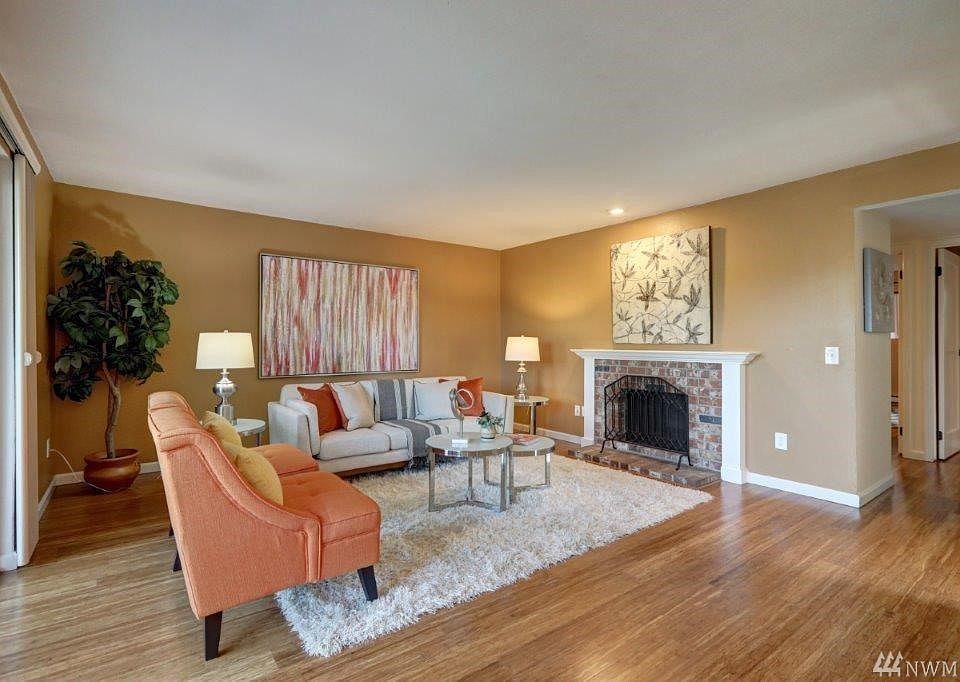 Spacious Living Room with wood burning fireplace and new interior paint!