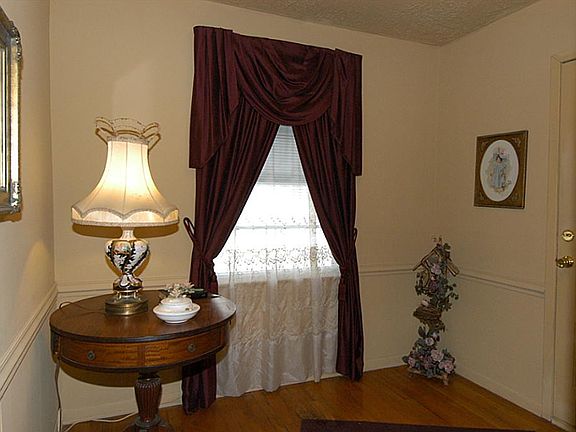 WELCOMING ENTRY BOASTS ORIGINAL WOOD FLOORS.  LOVELY!