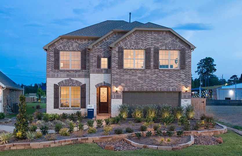 The Caldwell, a two-story home with 2-car cedar garage, shown as Home Exterior C