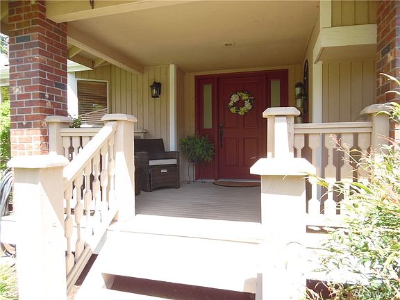 Inviting front porch with sitting area.